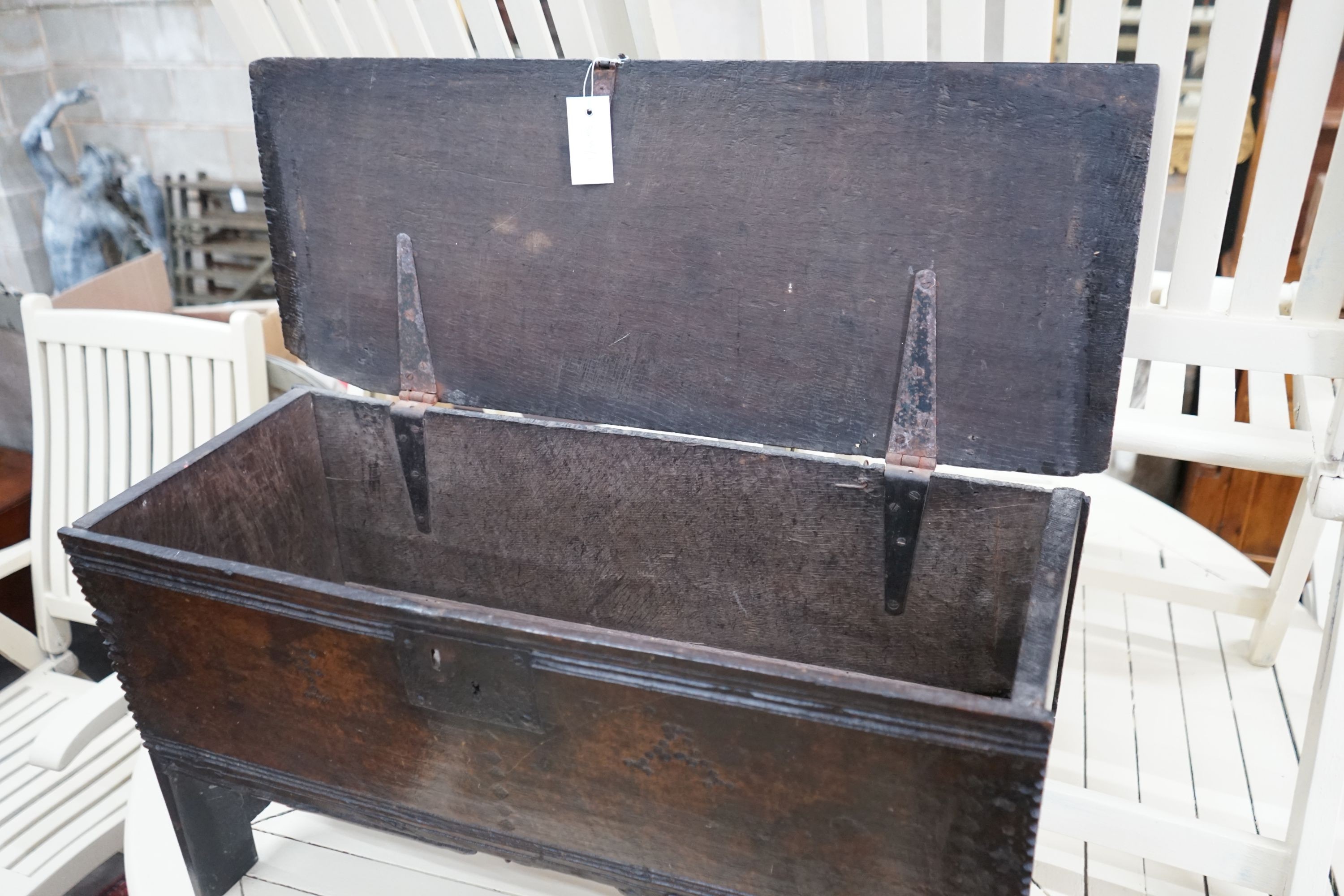 A small 17th century oak six plank coffer, punch struck with the initials I A, width 79cm, depth 32cm, height 44cm